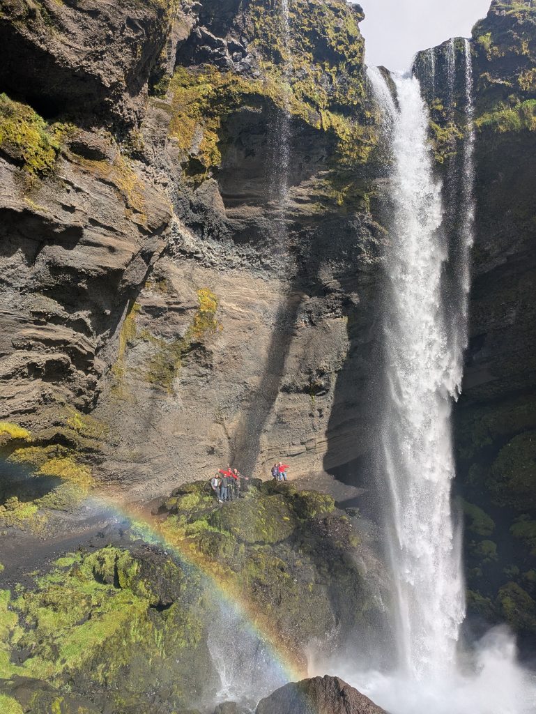 Hiking group behind the waterfall